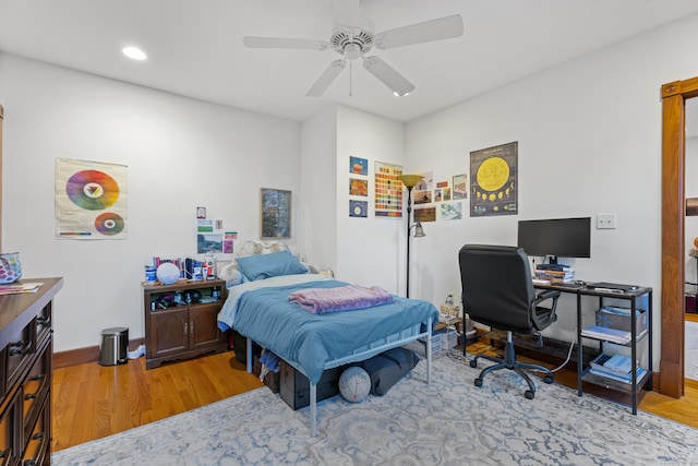 bedroom with wood-type flooring and ceiling fan