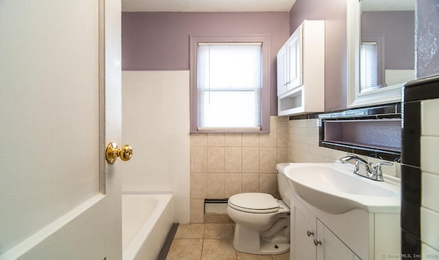 bathroom with vanity, tile patterned flooring, toilet, tile walls, and a tub