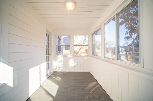 unfurnished sunroom with wooden ceiling