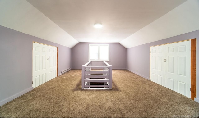 bonus room featuring carpet flooring, a baseboard radiator, and vaulted ceiling