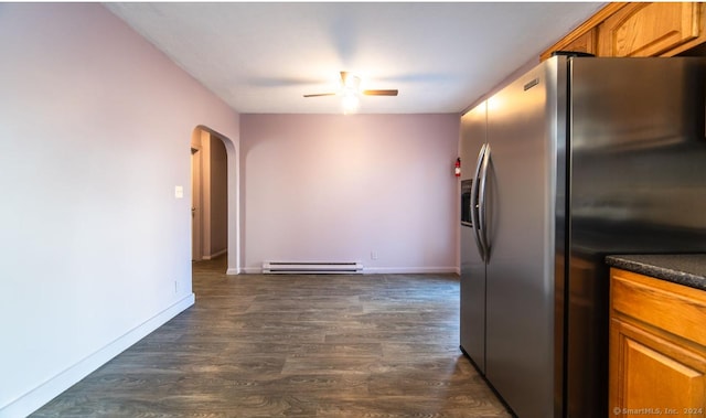 kitchen with ceiling fan, dark hardwood / wood-style flooring, stainless steel fridge with ice dispenser, and baseboard heating