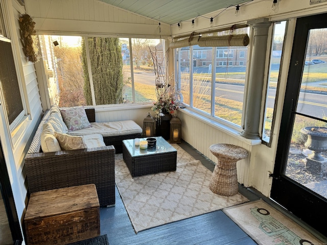 sunroom / solarium with wood ceiling, lofted ceiling, and a wealth of natural light