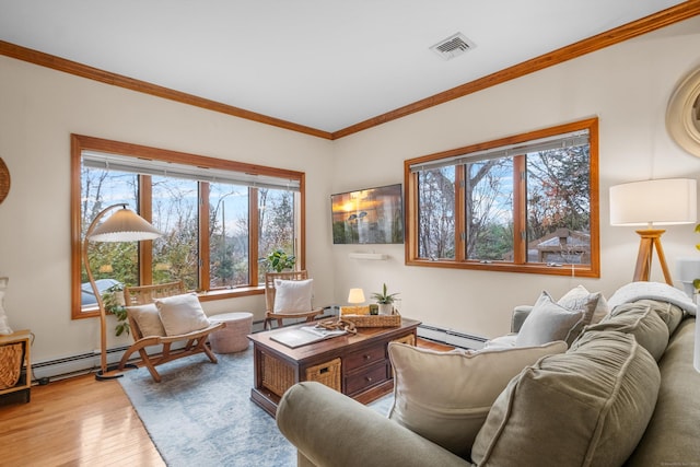 living room with a baseboard radiator, ornamental molding, and light wood-type flooring