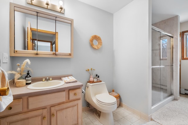 bathroom featuring a shower with door, a baseboard heating unit, vanity, tile patterned floors, and toilet