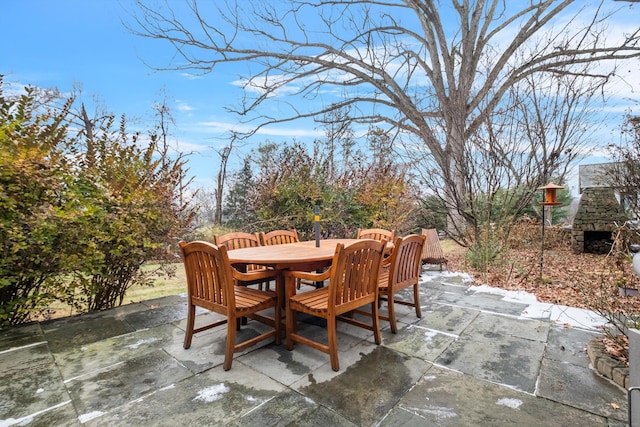 view of patio / terrace with an outdoor stone fireplace