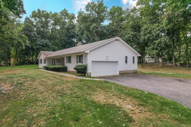 single story home with a garage and a front yard