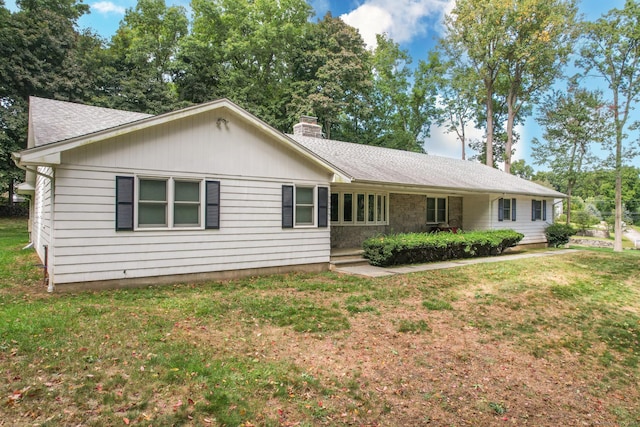 view of front of home with a front yard