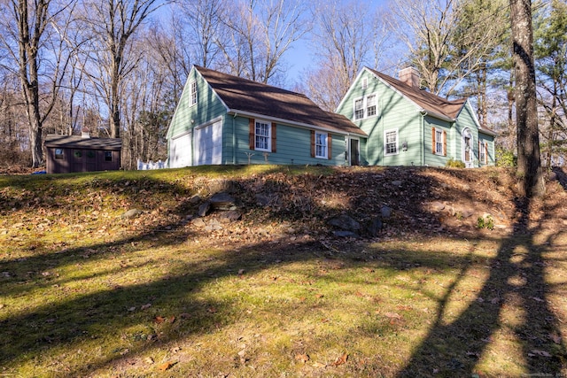 view of home's exterior featuring a yard and a shed