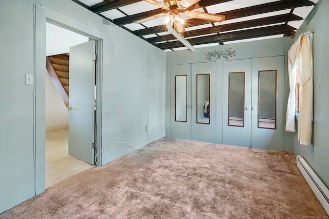 unfurnished bedroom featuring beamed ceiling, ceiling fan, light colored carpet, and a baseboard radiator