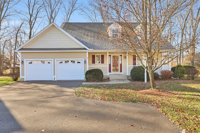 view of front facade with covered porch and a garage