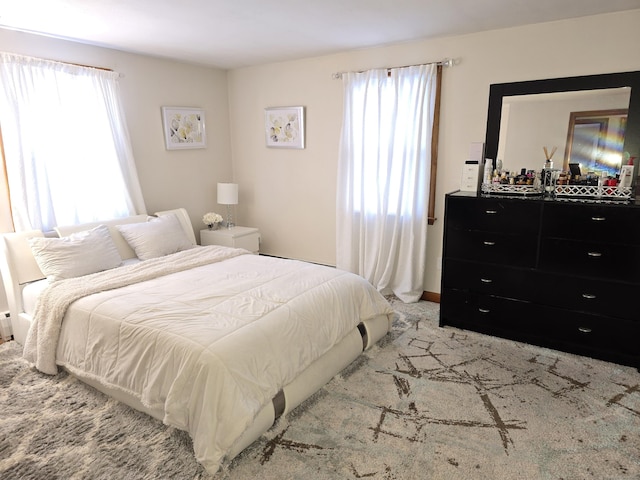 bedroom with light colored carpet