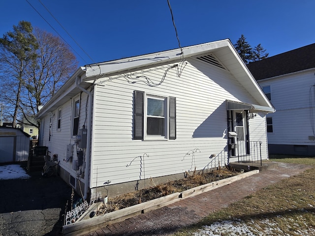 view of front of home featuring a garage and an outdoor structure