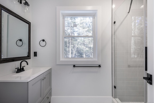 bathroom featuring a stall shower and vanity