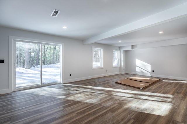 unfurnished living room featuring recessed lighting, baseboards, wood finished floors, and beamed ceiling