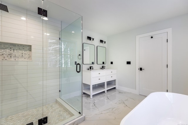 full bathroom featuring marble finish floor, double vanity, a soaking tub, a stall shower, and baseboards