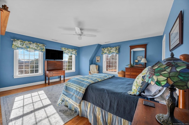 bedroom featuring ceiling fan and light hardwood / wood-style flooring