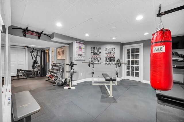 gym featuring a paneled ceiling