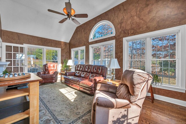 living room featuring hardwood / wood-style flooring, vaulted ceiling, plenty of natural light, and ceiling fan