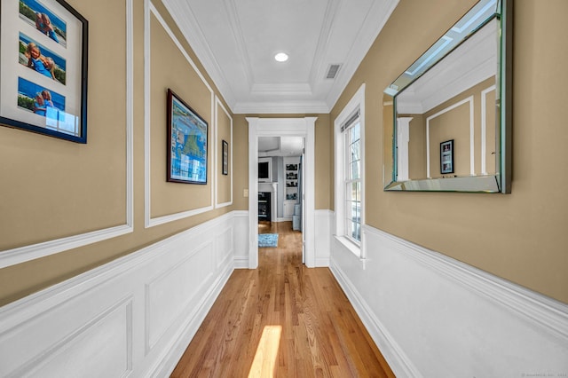 23 Olmstead Rd, East Haddam, CT 06423 - corridor featuring light wood finished floors, crown molding, a decorative wall, and a wainscoted wall