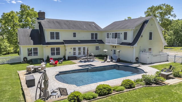 23 Olmstead Rd, East Haddam, CT 06423 - back of house featuring a chimney, a balcony, a patio area, a fire pit, and a gate