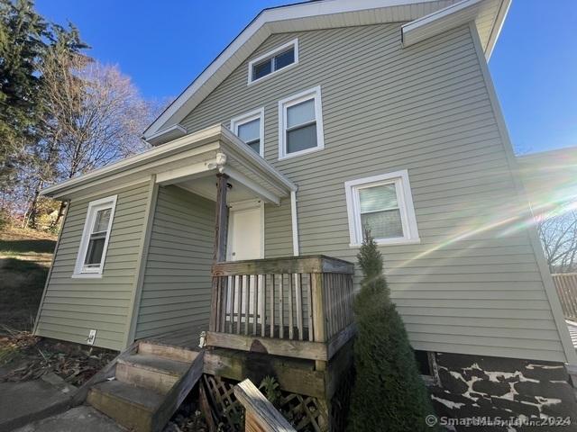 back of house featuring a deck