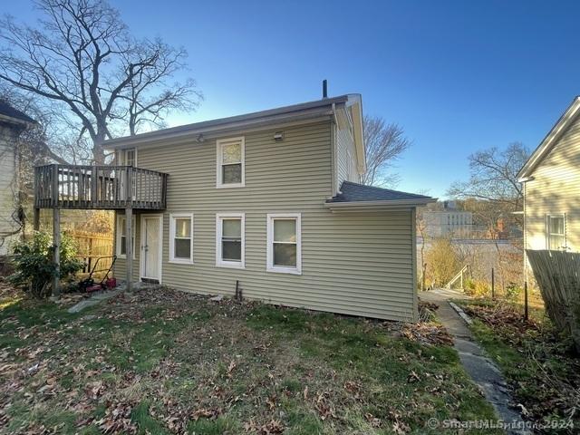 rear view of property with a deck