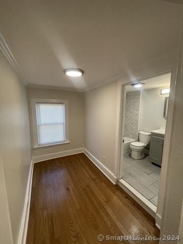 interior space featuring dark hardwood / wood-style floors and connected bathroom