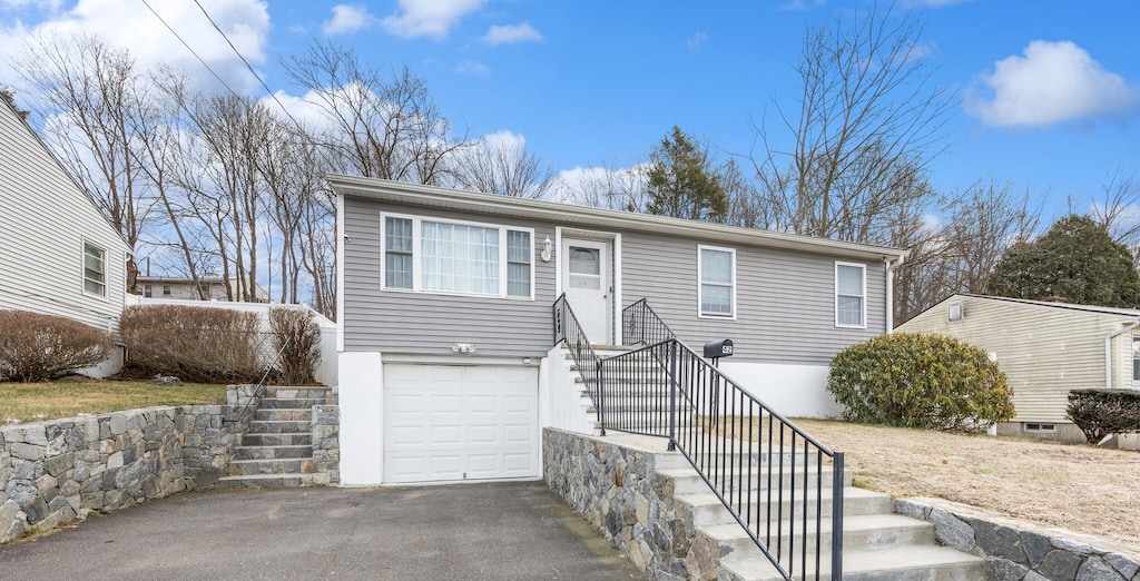 view of front of home with a garage