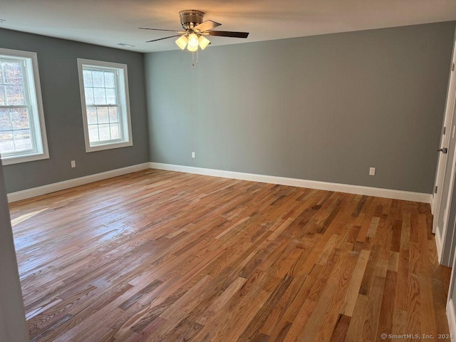 unfurnished room with light hardwood / wood-style floors and ceiling fan