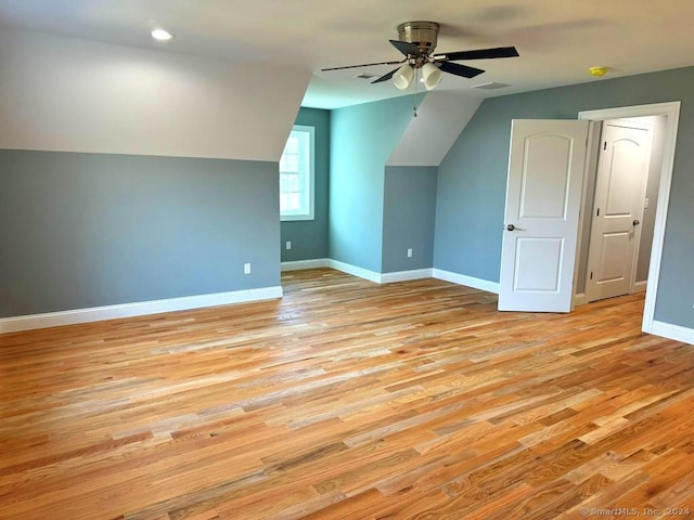 bonus room with ceiling fan, light hardwood / wood-style floors, and lofted ceiling