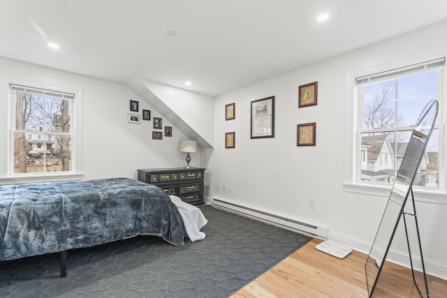 23 Moore Ave, New London, CT 06320 - bedroom featuring a baseboard radiator, multiple windows, wood finished floors, recessed lighting, and baseboards