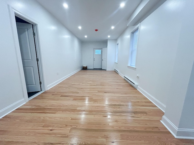 23 Moore Ave, New London, CT 06320 - corridor featuring a baseboard heating unit, light wood finished floors, baseboards, and recessed lighting