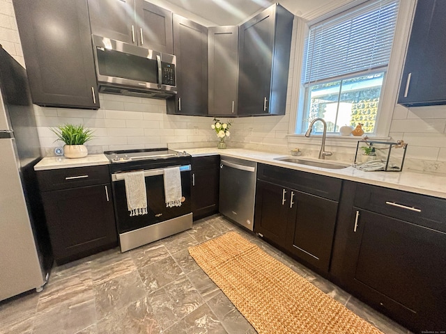 23 Moore Ave, New London, CT 06320 - kitchen with appliances with stainless steel finishes, a sink, decorative backsplash, and light countertops
