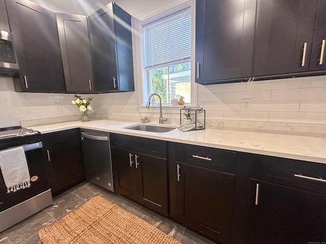 23 Moore Ave, New London, CT 06320 - kitchen featuring stainless steel appliances, a sink, tasteful backsplash, dark cabinetry, and light stone countertops
