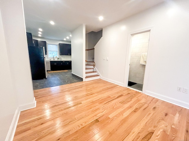 23 Moore Ave, New London, CT 06320 - unfurnished living room with stairway, dark wood-type flooring, recessed lighting, and baseboards