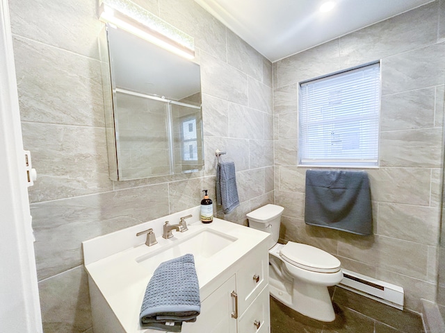 bathroom featuring a baseboard radiator, a shower with door, vanity, tile walls, and toilet