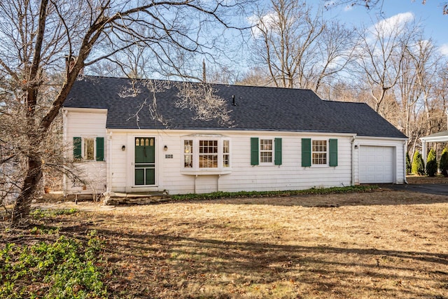 ranch-style home featuring a garage and a front lawn