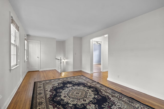 empty room featuring ceiling fan and wood-type flooring