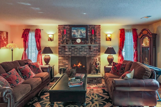 living room featuring a fireplace and a textured ceiling