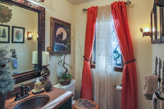 bathroom with vanity and toilet