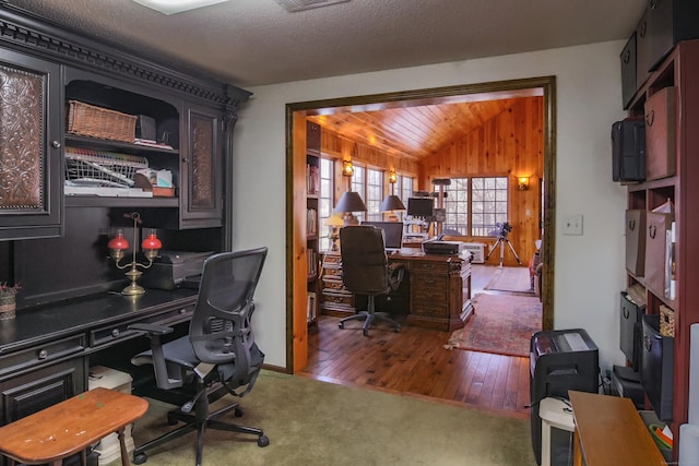 office space featuring dark hardwood / wood-style flooring, a textured ceiling, and vaulted ceiling