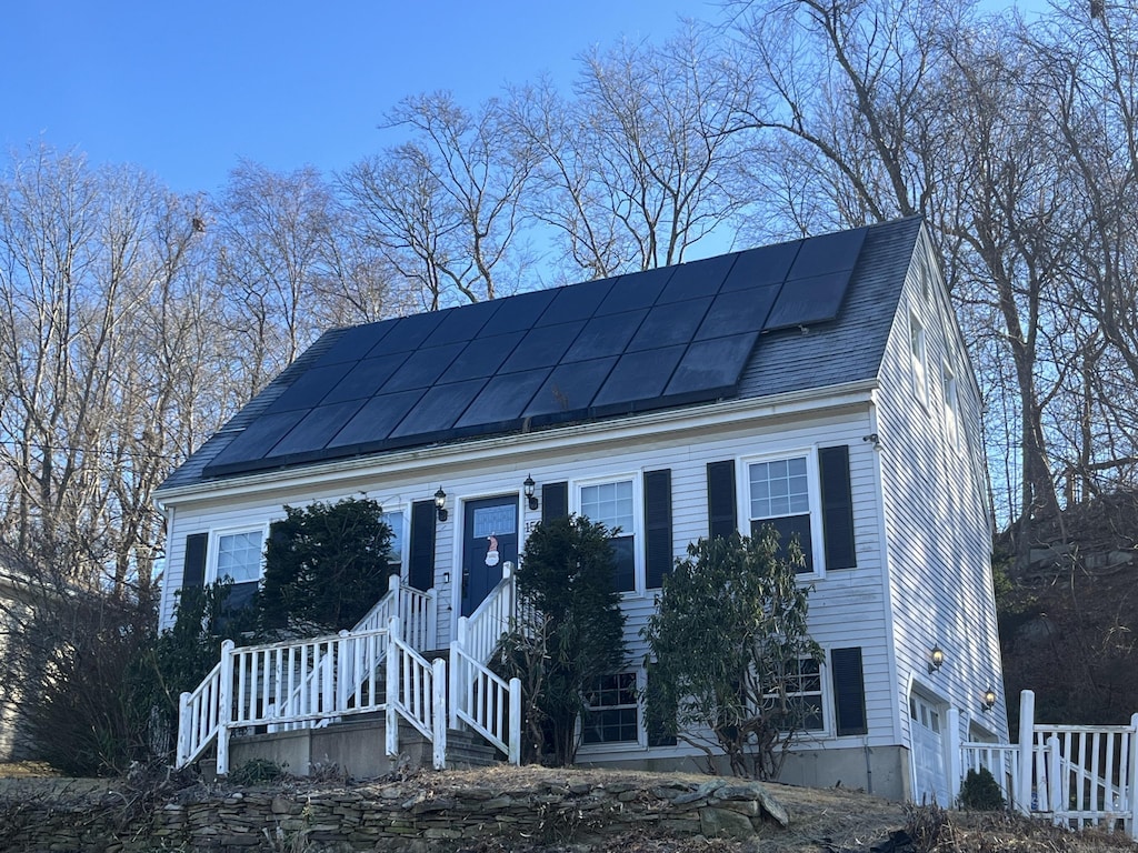 view of front of house featuring solar panels