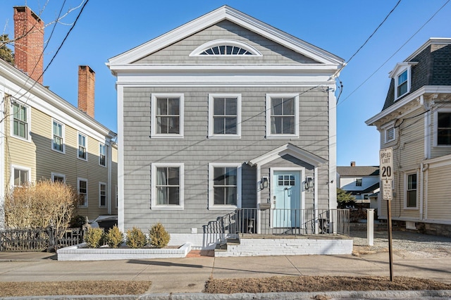 view of front of house featuring fence