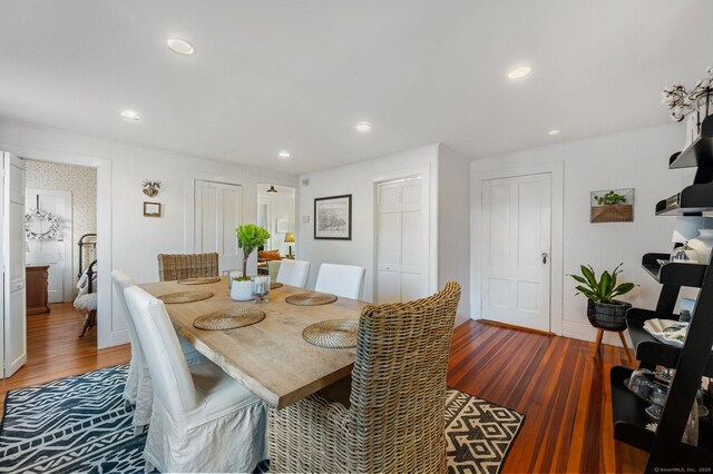 dining area featuring dark hardwood / wood-style floors