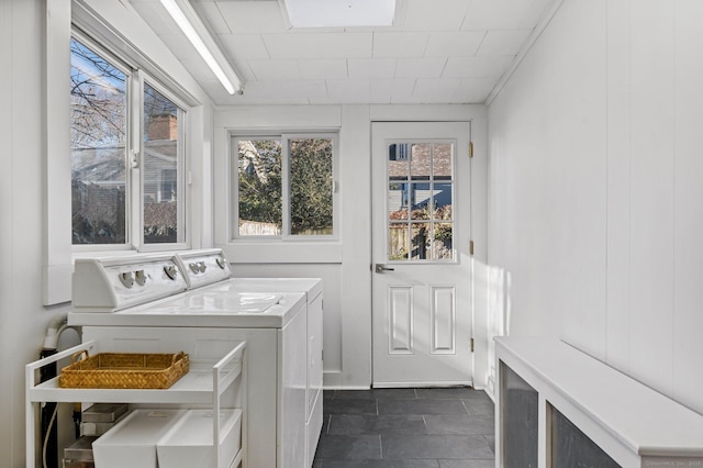 washroom featuring separate washer and dryer and laundry area