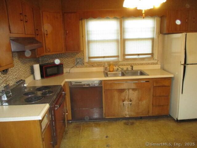 kitchen featuring white refrigerator, sink, black dishwasher, tasteful backsplash, and electric stove