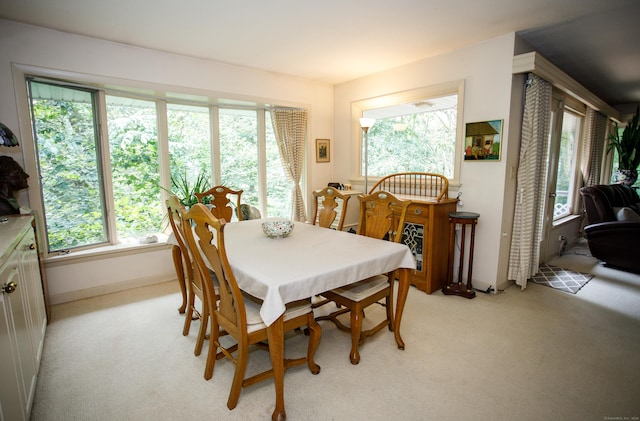 view of carpeted dining space