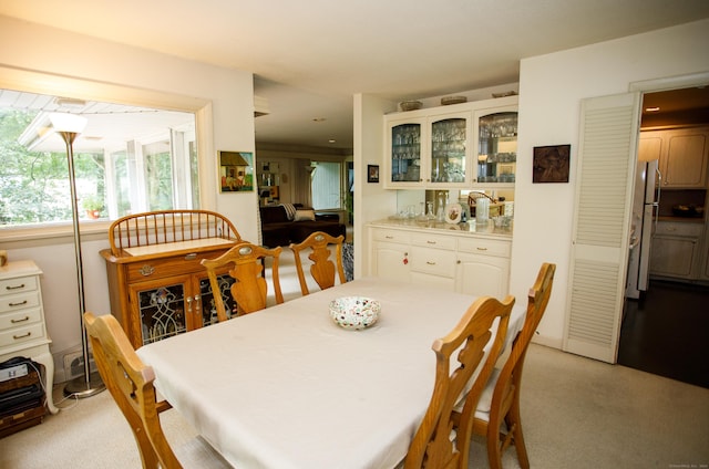 view of carpeted dining space