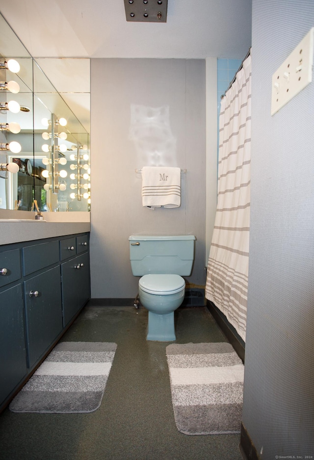 bathroom featuring vanity and toilet