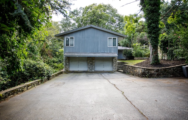 view of side of property featuring a garage